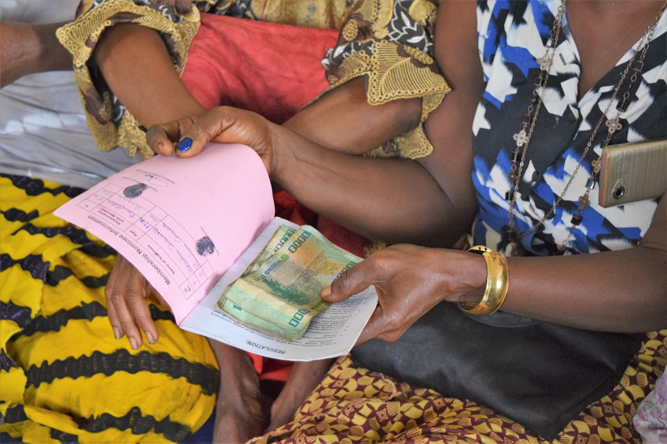 Women counting money in Sierra Leone